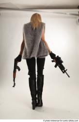 Woman Adult Average White Fighting with gun Standing poses Coat